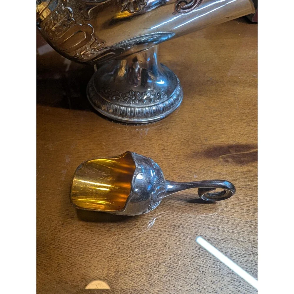 vintage silver-plated sugar scuttle with a matching mini scoop